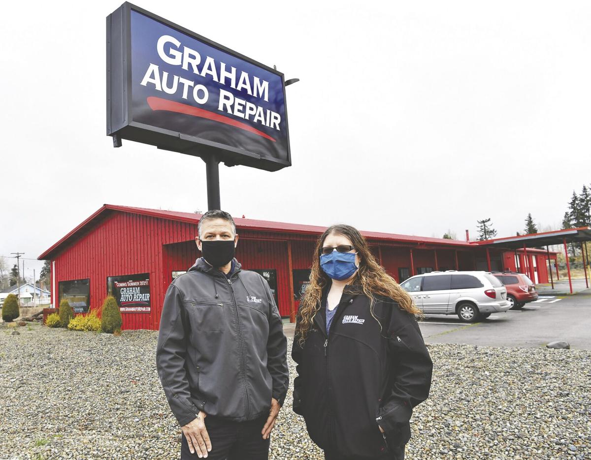 Graham Auto Repair Owner Troy Vaninetti and Digital Media/Recruiting Manger Lacie Ugelstad, standing in front of the new Yelm Shop in Yelm, WA 98597